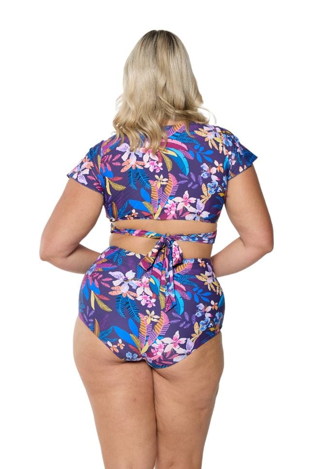 Back of model wearing cap sleeve bikini top for curve women
