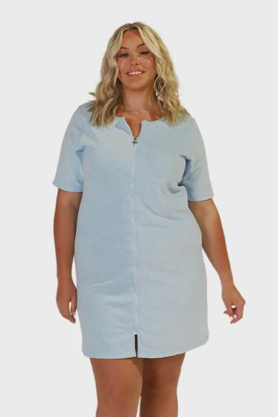 Blonde model in studio wearing plus size mini beach coverup dress in powder blue terry towelling