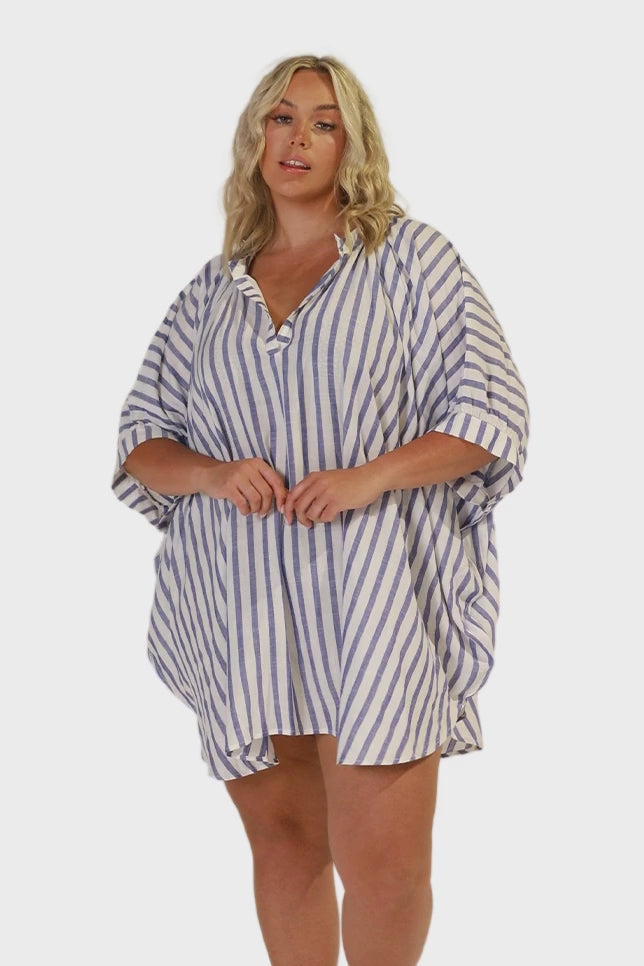 Video of plus size women wearing a v neckline dress in white and blue stripes for curve women