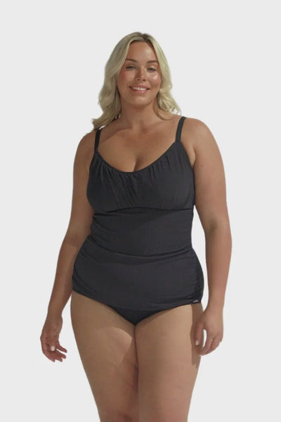 Blonde model wearing black honey comb textured underwire tankini