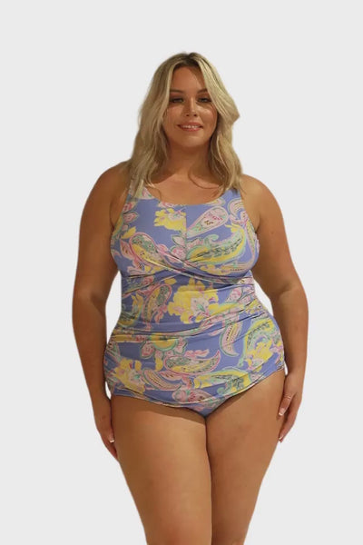 Video of model in studio wearing plus size tankini top with pastel coloured paisley print