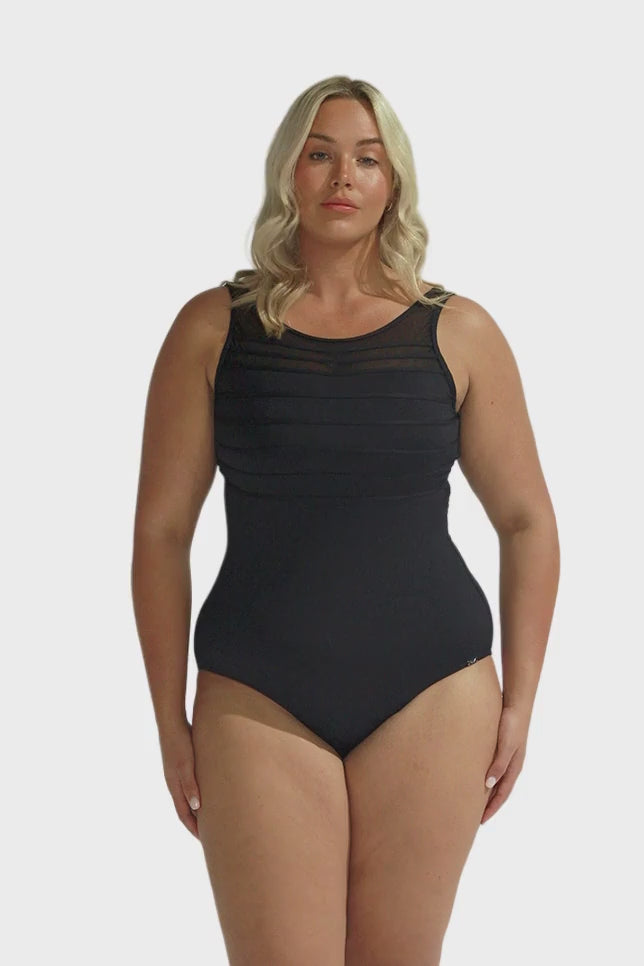 Blonde model wearing black high neck mesh one piece