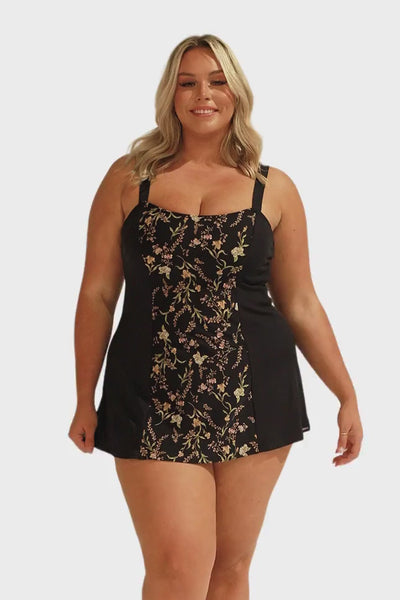 Model wearing black floral swim dress