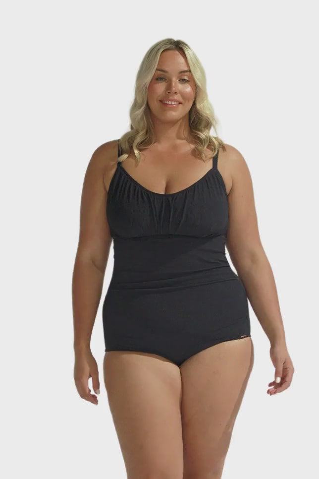 Blonde model wearing black textured underwire one piece