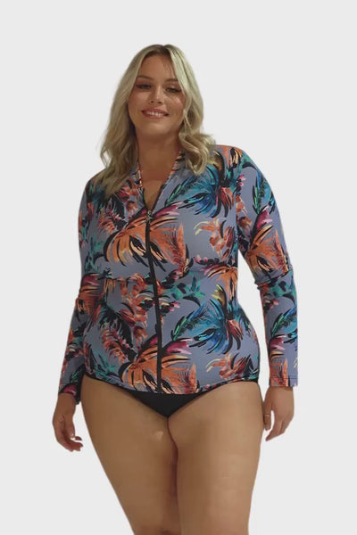 Video of model in studio wearing multicoloured floral long sleeve rash vest for plus size women