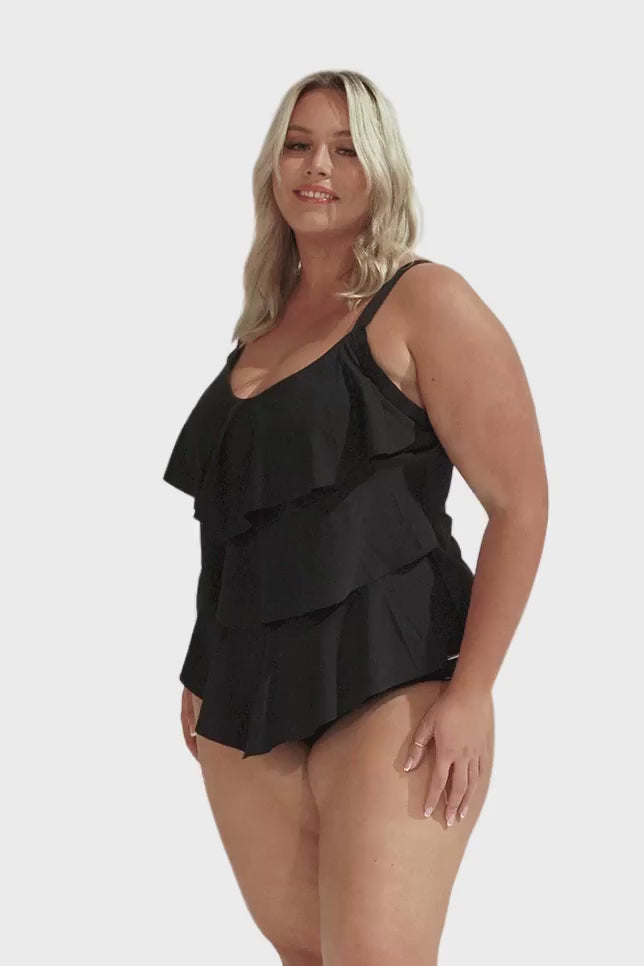 Model wearing black 3 tier tankini top