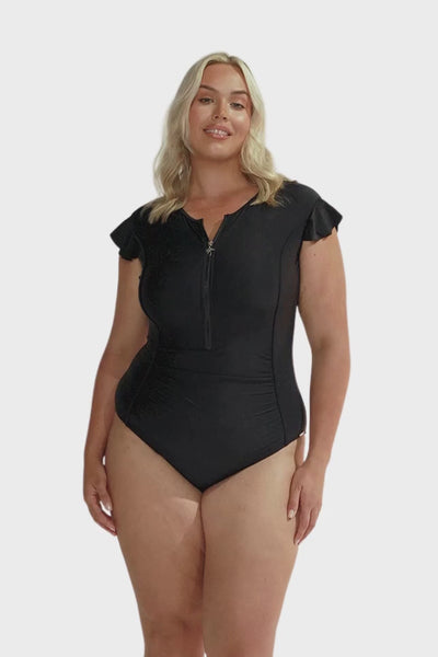 plus size model wears black high neck zip front one piece with cap sleeves