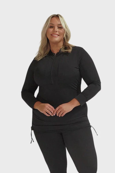 Video of model wearing long sleeve rash vest in black with zip front detail and ruching in chlorine resistant