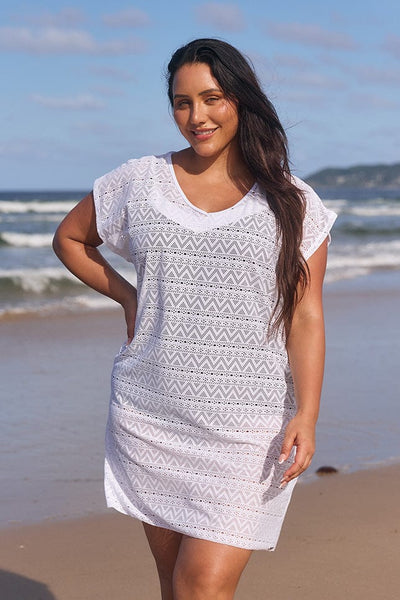 model wearing white mesh cover up