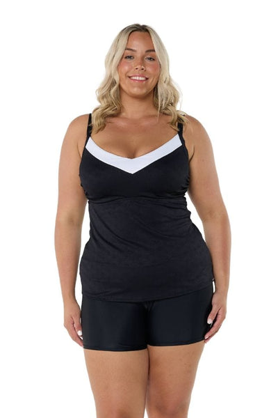 Blonde model wearing black and white underwire tankini top